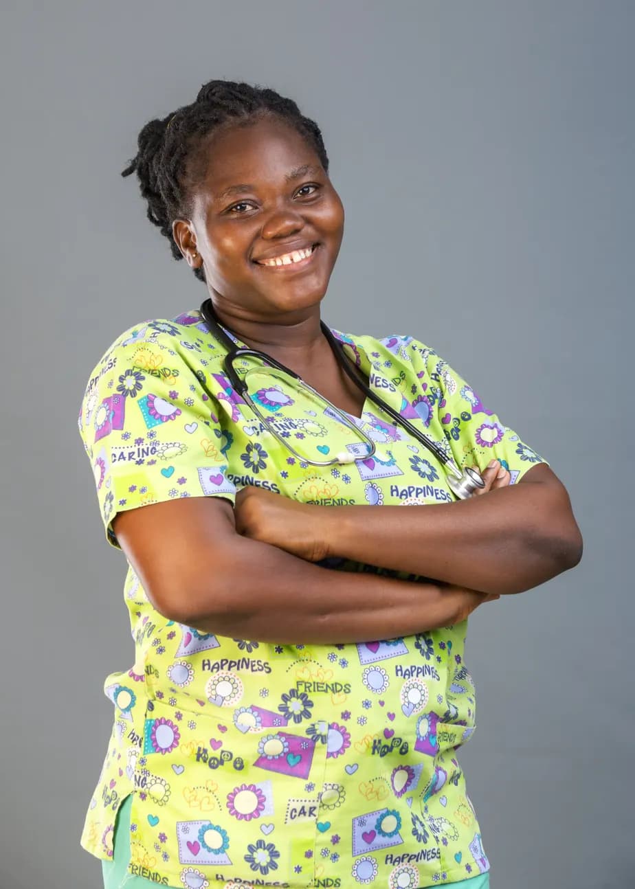 Liahona care team member smiling with a stethoscope