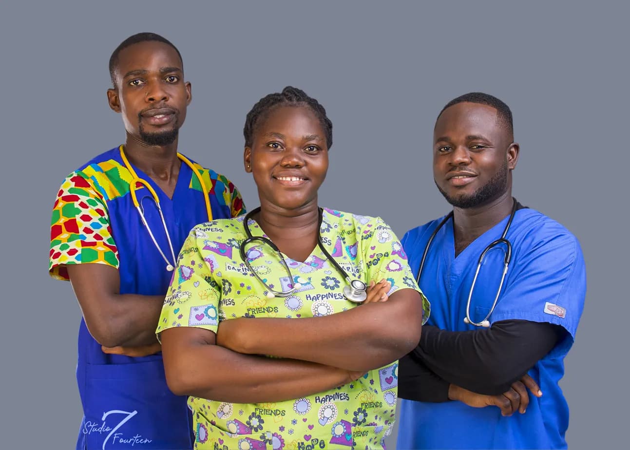 Three members of the Liahona care team in scrubs, smiling